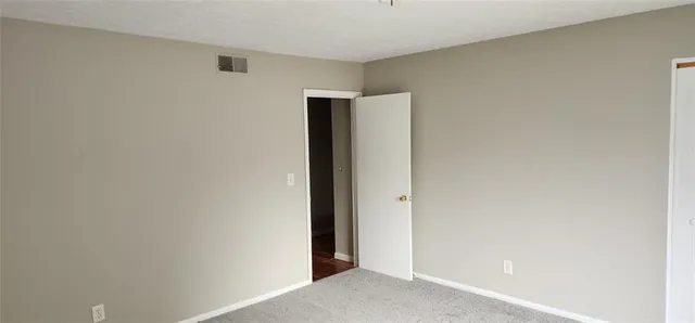 a view of a backyard with wooden fence