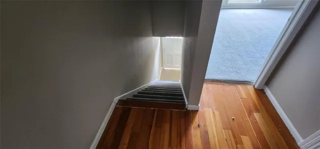 a bathroom with a sink a mirror and shower