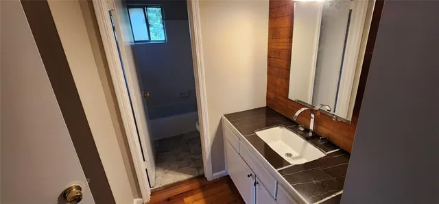 a bathroom with a sink and a shower