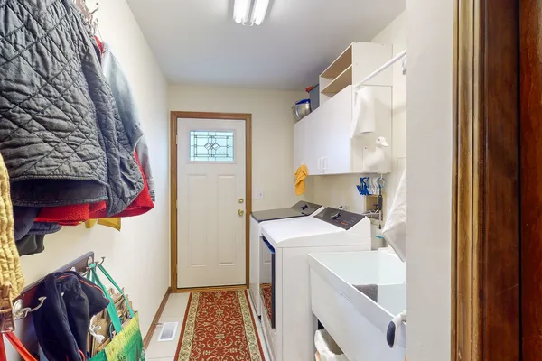 a utility room with dryer and washer