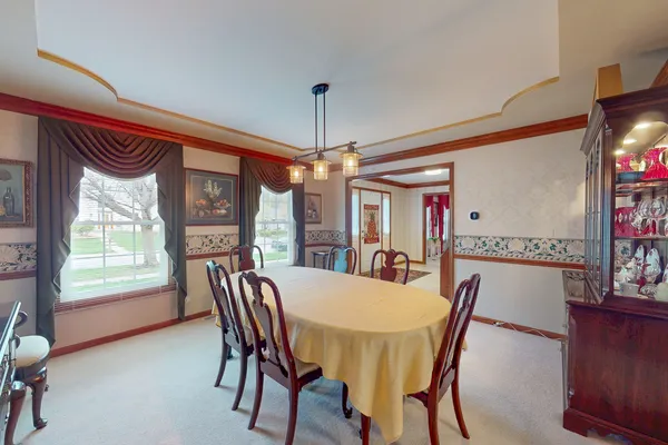 a view of a dining room with furniture window and outside view