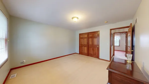 an empty room with mirror