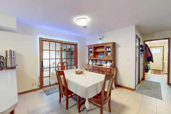 a view of a dining room with furniture and a window