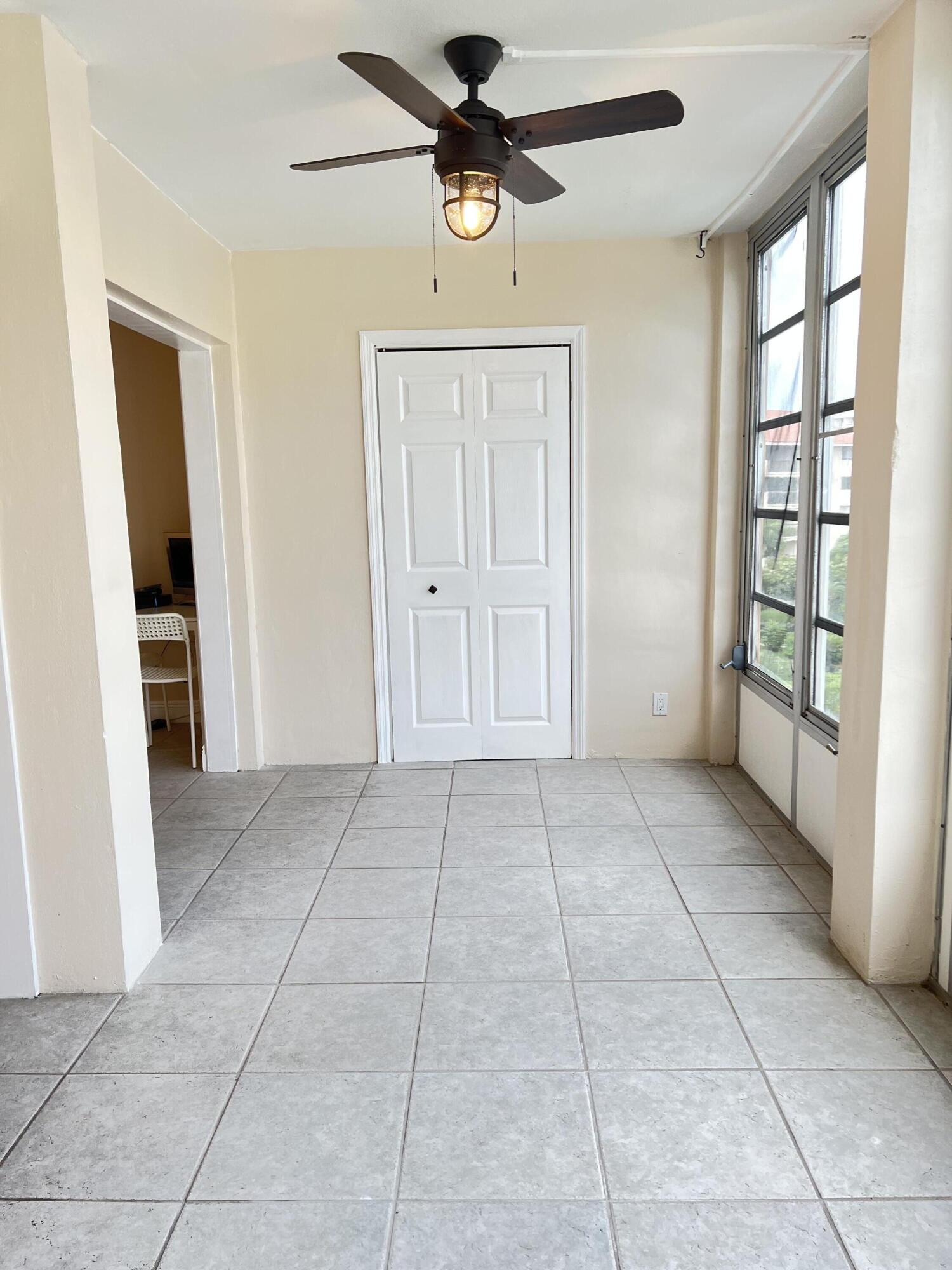 308 Golfview Road, Unit 405 North Palm Beach, FL 33408 - Photo 16 of 20 a view of an empty room with a window