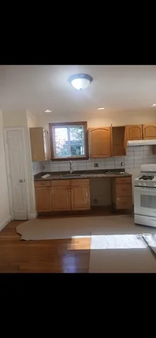 a living room with stainless steel appliances