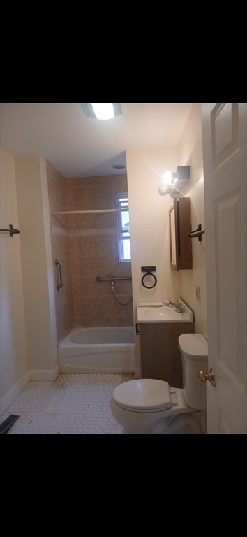 14 Howe Terrace, Unit 1 Boston, MA 02125 - Photo 7 of 7 a bathroom with a sink and a mirror