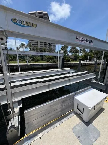 a view of a swimming pool with outdoor seating