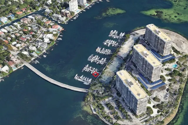 a view of water with boats and trees in the background