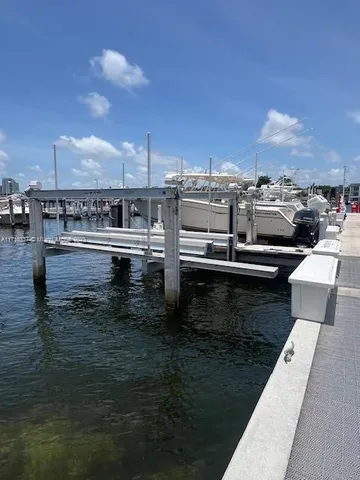a view of a lake with a car parked on the road