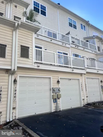 a front view of a building with a lots of windows