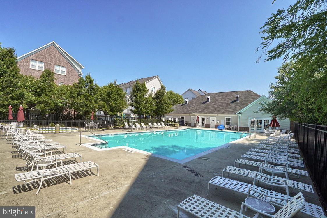 19461 Dover Cliffs Circle, Unit 19461 Germantown, MD 20874 - Photo 10 of 13 a view of a house with a yard and road