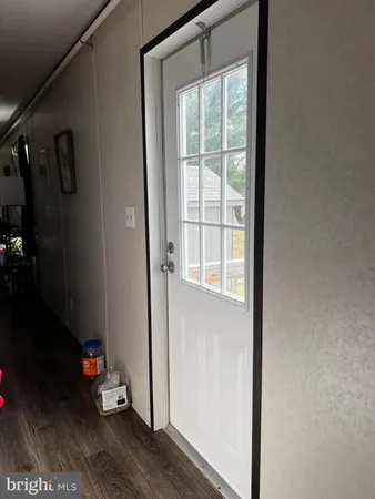 an empty room with wooden floor and closet