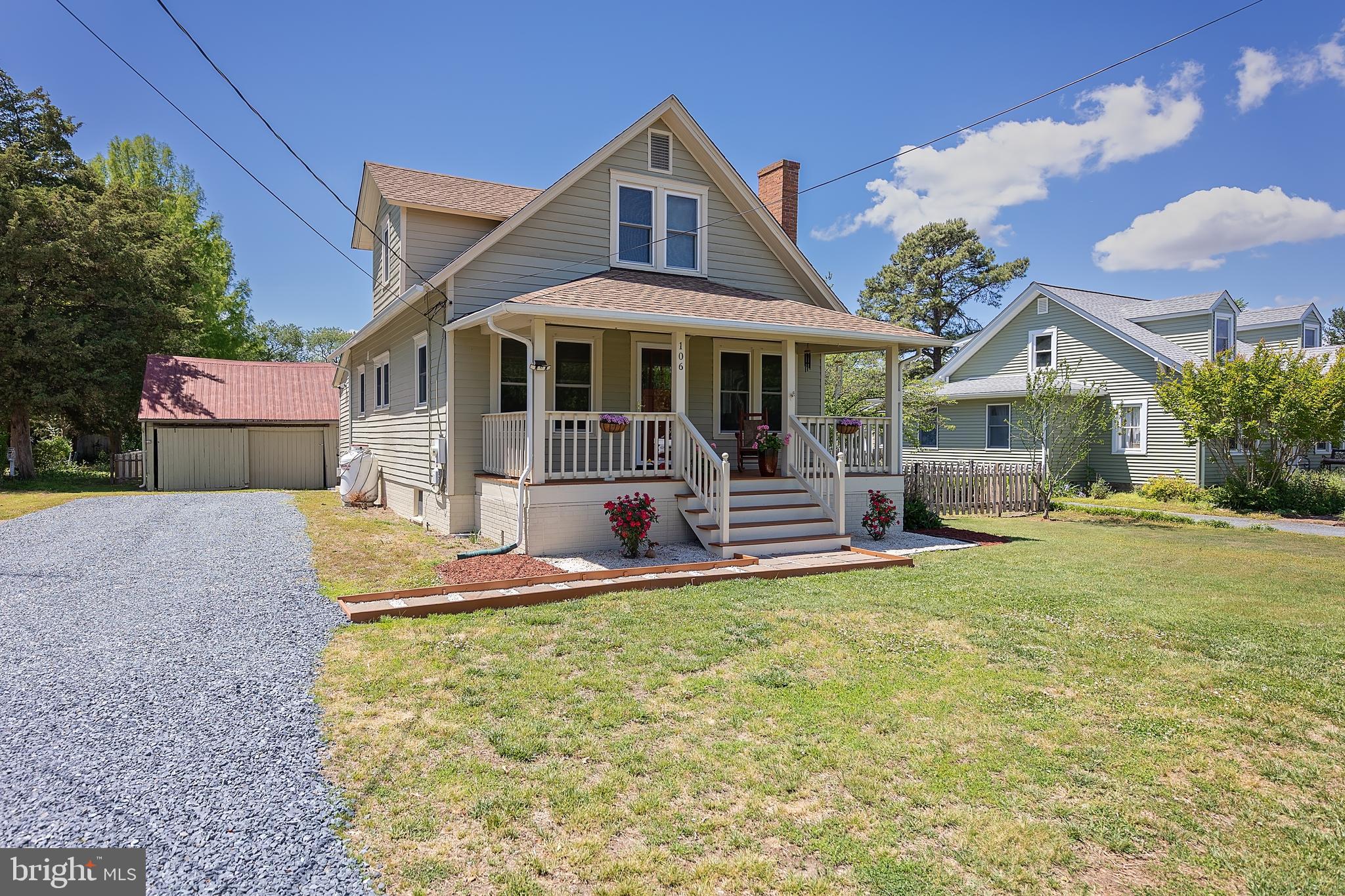 106 Main Street Preston, MD 21655 - Photo 2 of 31 a front view of a house with a yard table and chairs