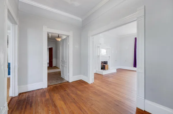 a view of a livingroom with wooden floor and closet
