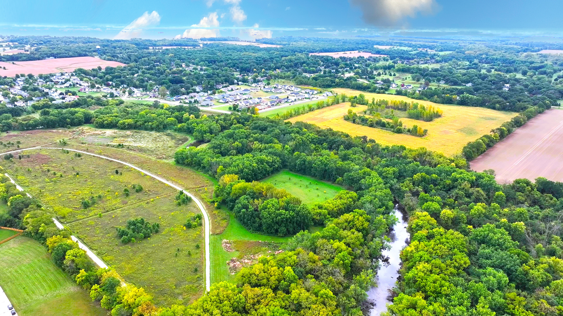 1002 Joshua Lane Genoa, IL 60135 - Photo 15 of 25 a view of a swimming pool with a yard
