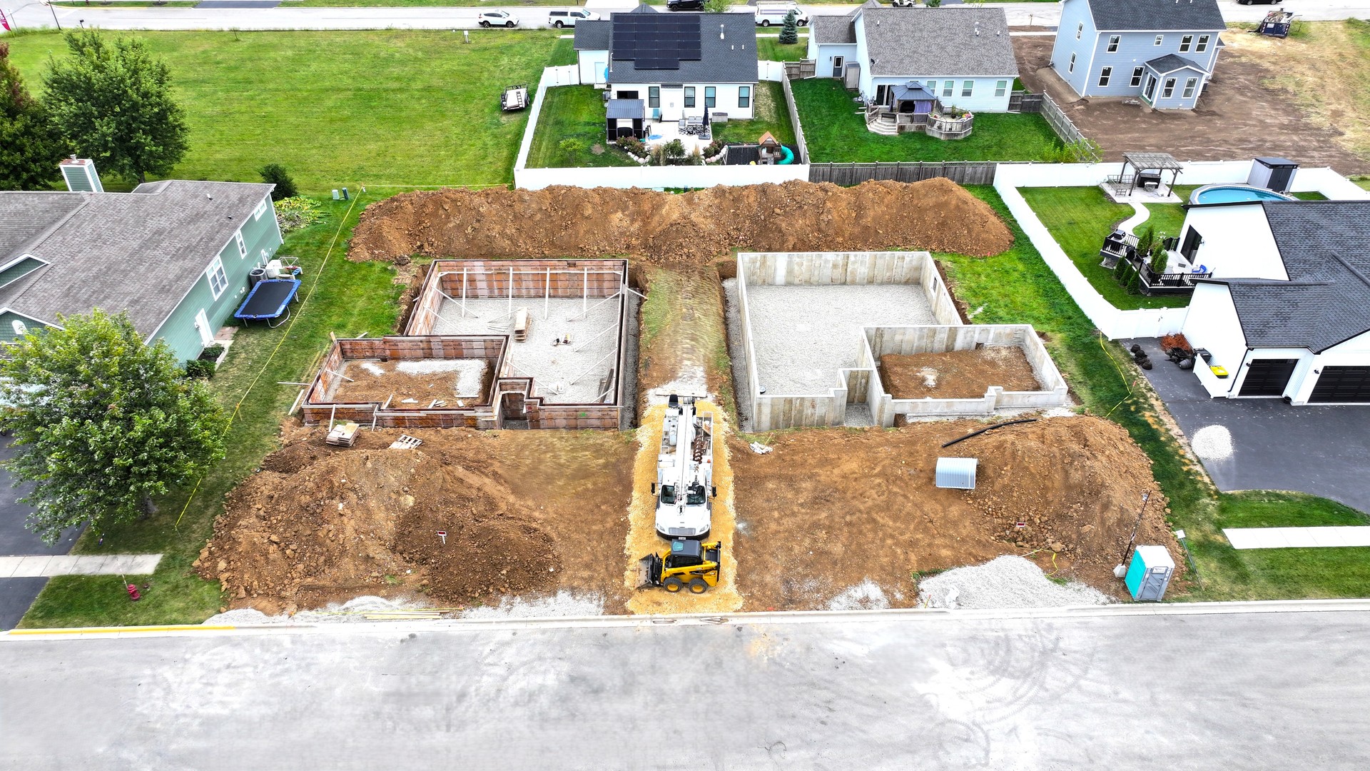 1002 Joshua Lane Genoa, IL 60135 - Photo 18 of 25 an aerial view of a house with a yard and lake view