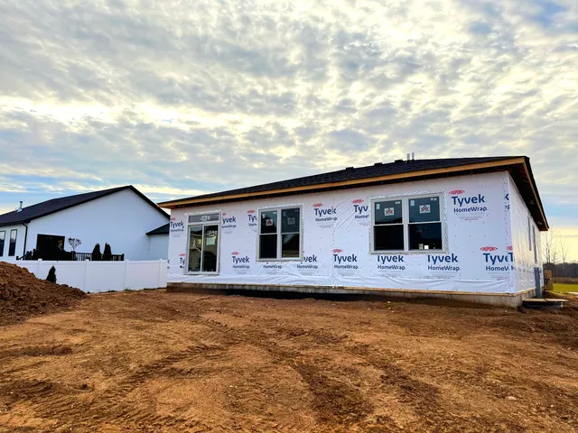 a view of a house with backyard space