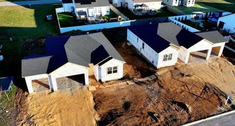 a view of a chairs with wooden floor