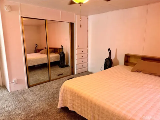 a bedroom with a bed and a cabinets