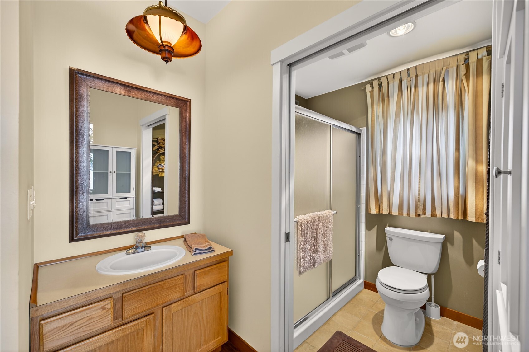 17946 Cobahud Road La Conner, WA 98257 - Photo 29 of 40 a bathroom with a toilet sink and mirror