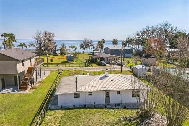 a aerial view of a house with a swimming pool