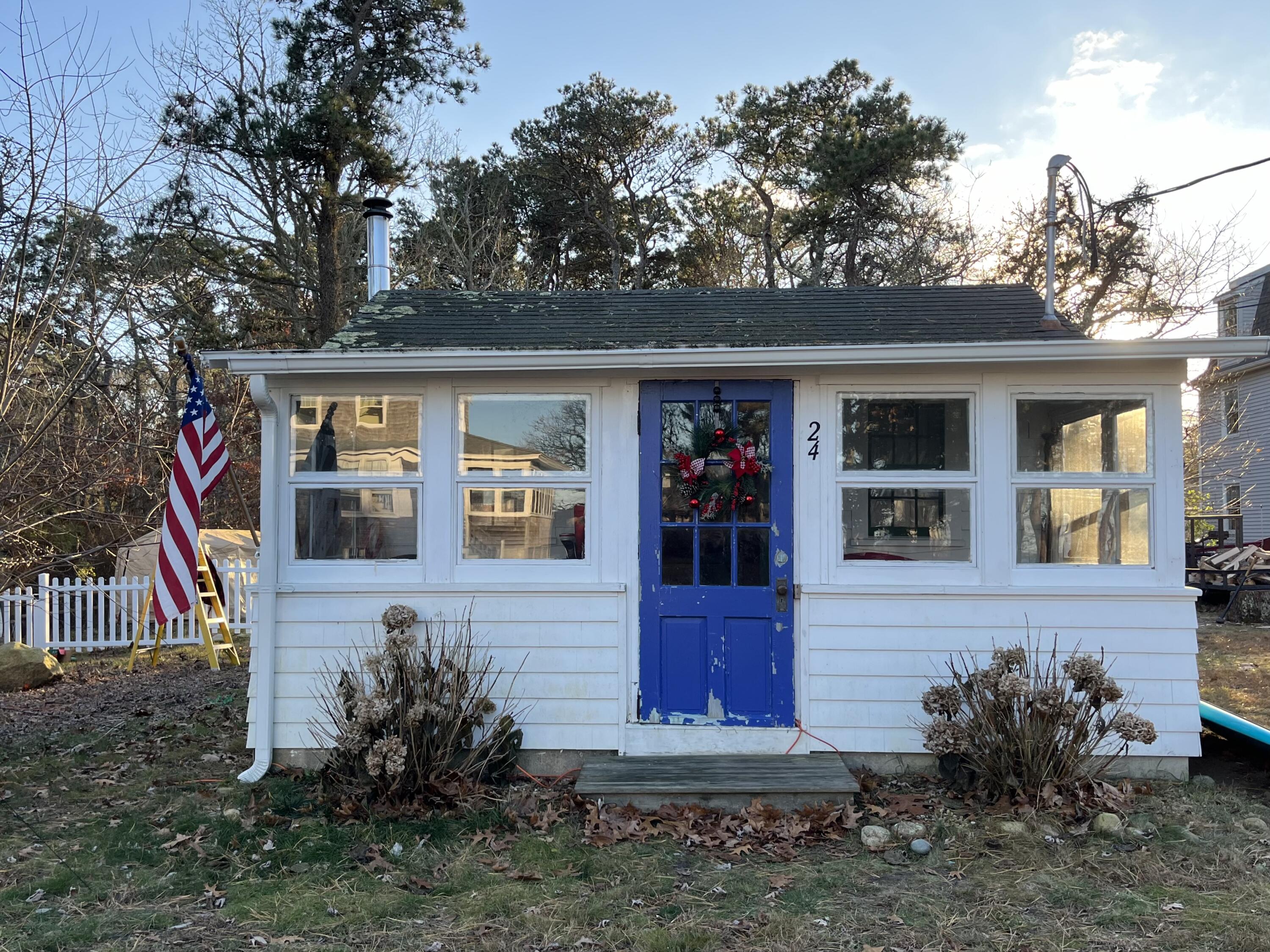 24 The Boulevard Edgartown, MA 02539 - Photo 2 of 14 front view of house with a yard