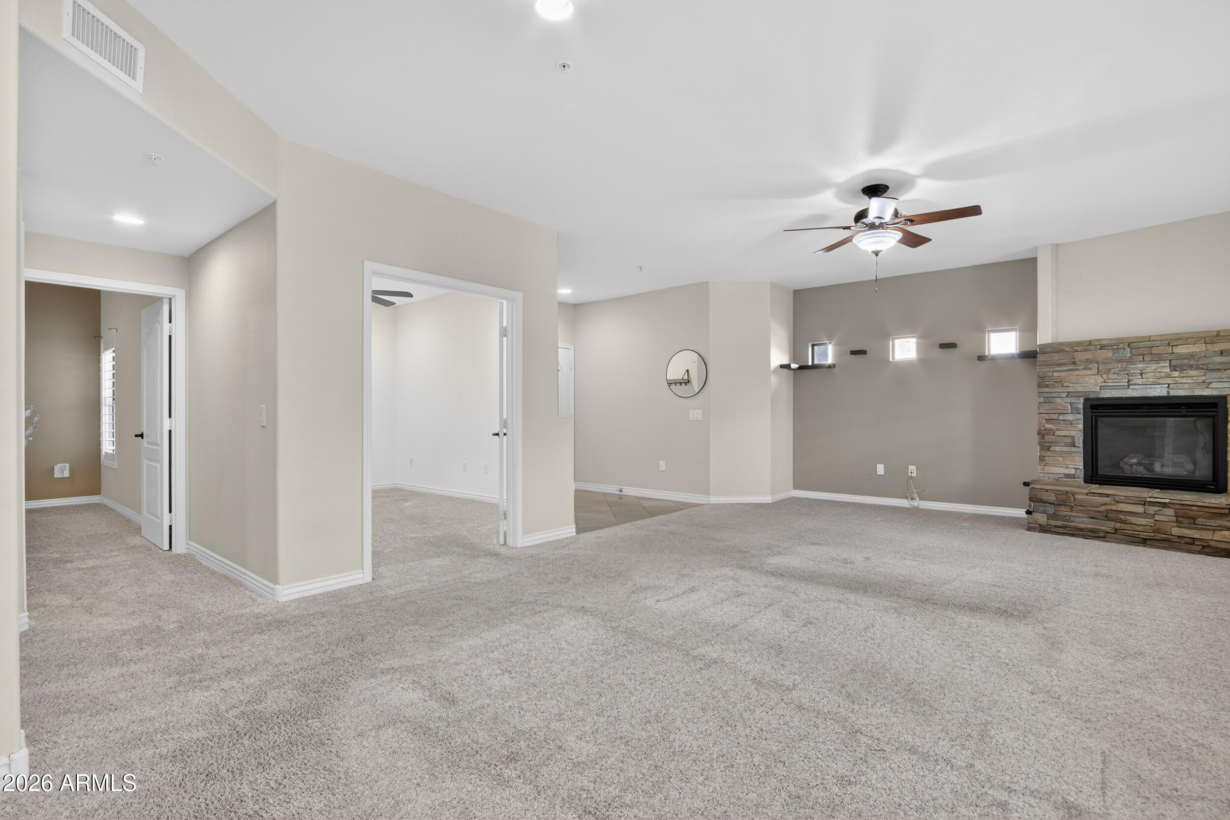 21320 North 56th Street, Unit 2125 Phoenix, AZ 85054 - Photo 12 of 39 a view of empty room with a fireplace