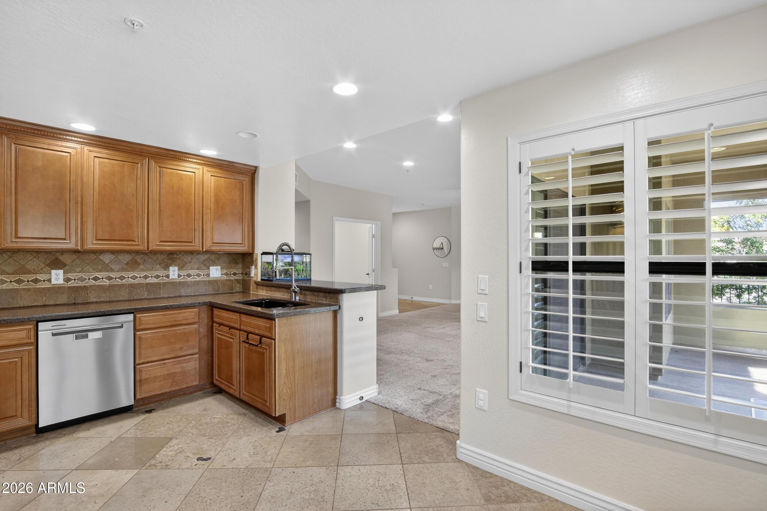 21320 North 56th Street, Unit 2125 Phoenix, AZ 85054 - Photo 13 of 39 a kitchen with stainless steel appliances granite countertop a stove and a sink