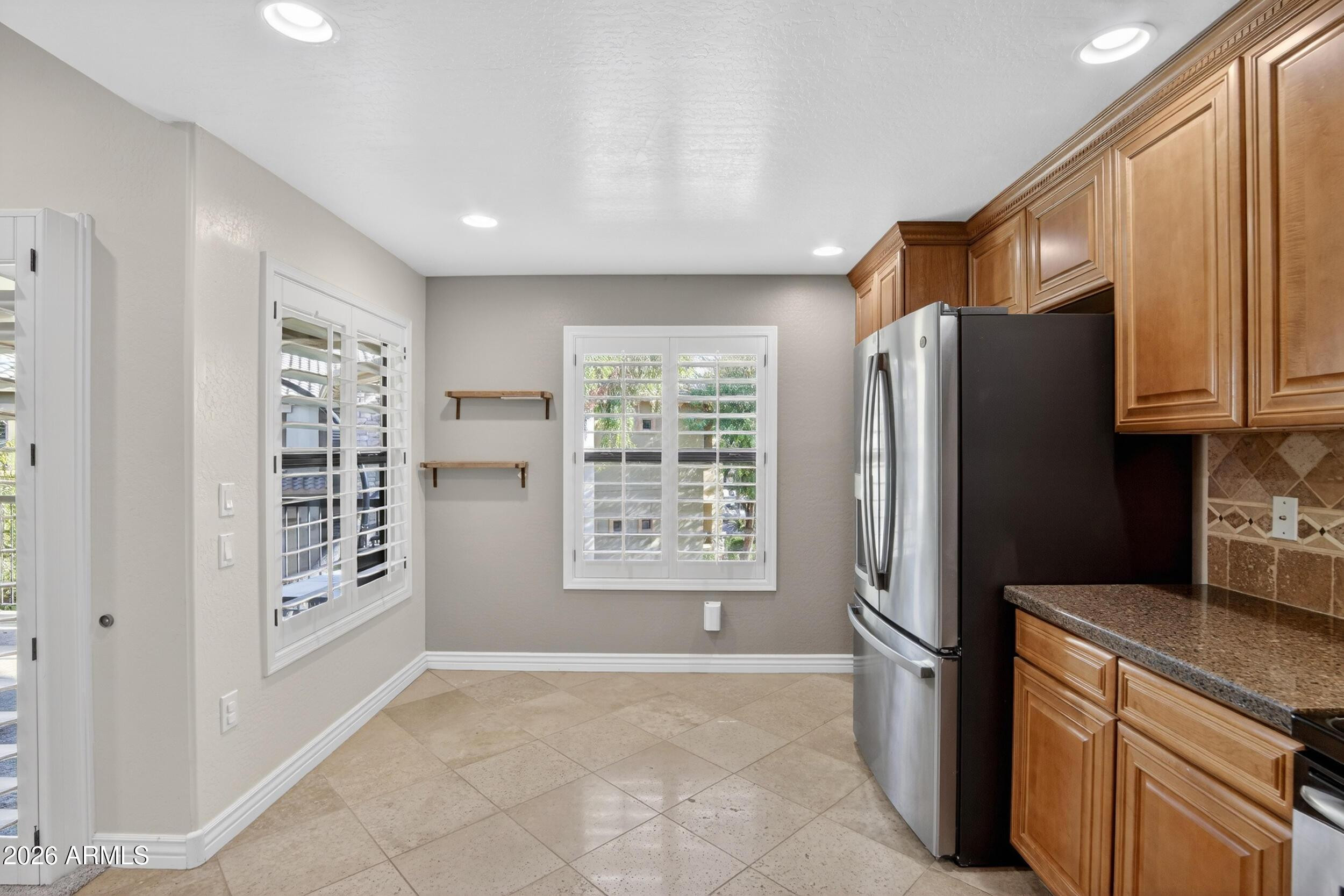 21320 North 56th Street, Unit 2125 Phoenix, AZ 85054 - Photo 16 of 39 a kitchen with stainless steel appliances a refrigerator and a stove top oven