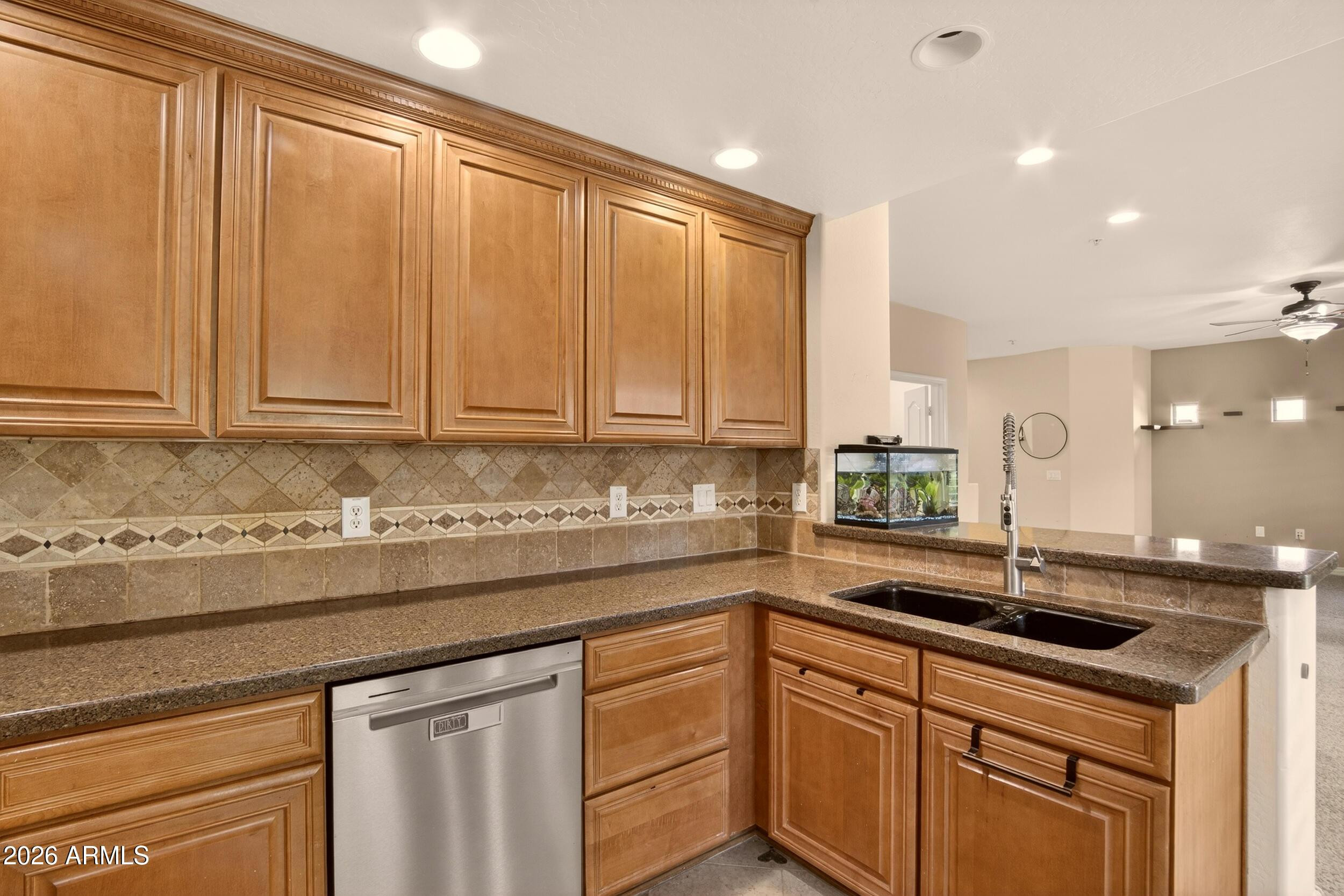 21320 North 56th Street, Unit 2125 Phoenix, AZ 85054 - Photo 17 of 39 a kitchen with stainless steel appliances granite countertop white cabinets and sink