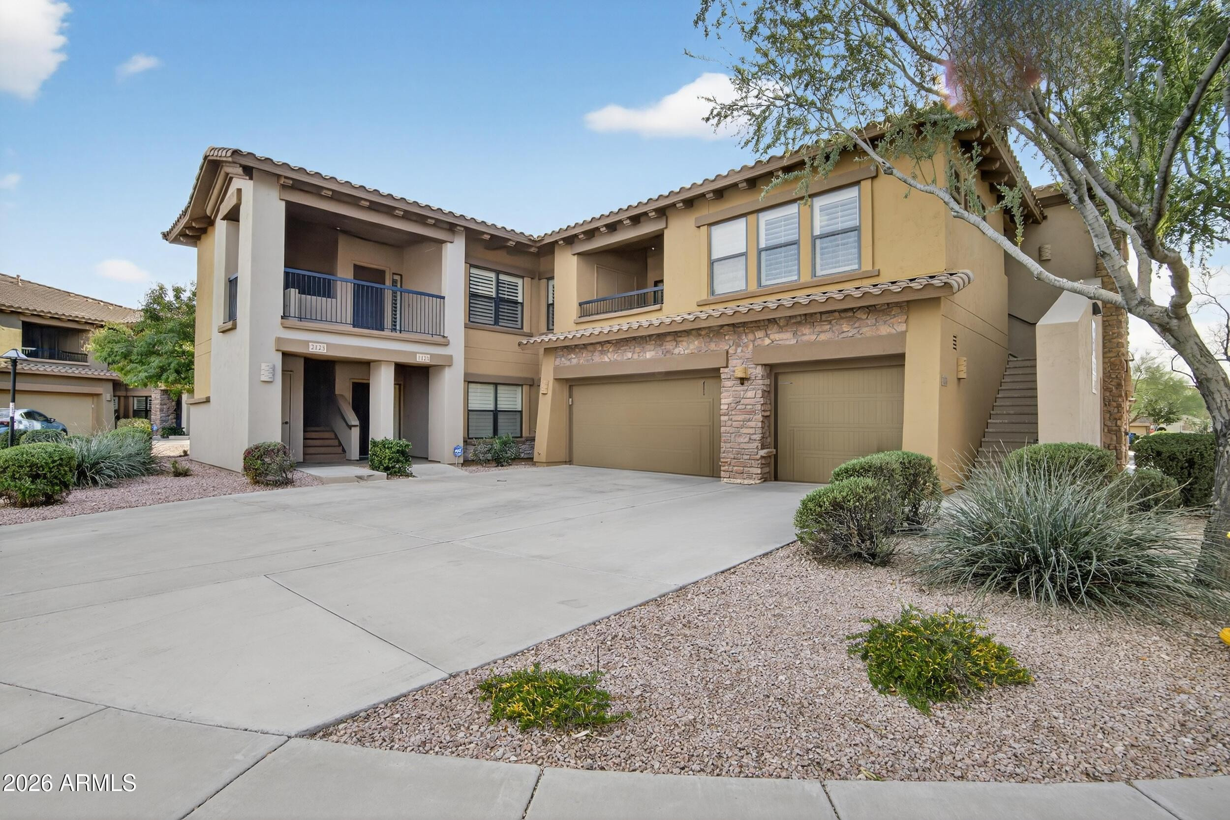 21320 North 56th Street, Unit 2125 Phoenix, AZ 85054 - Photo 2 of 39 a front view of a house with garden