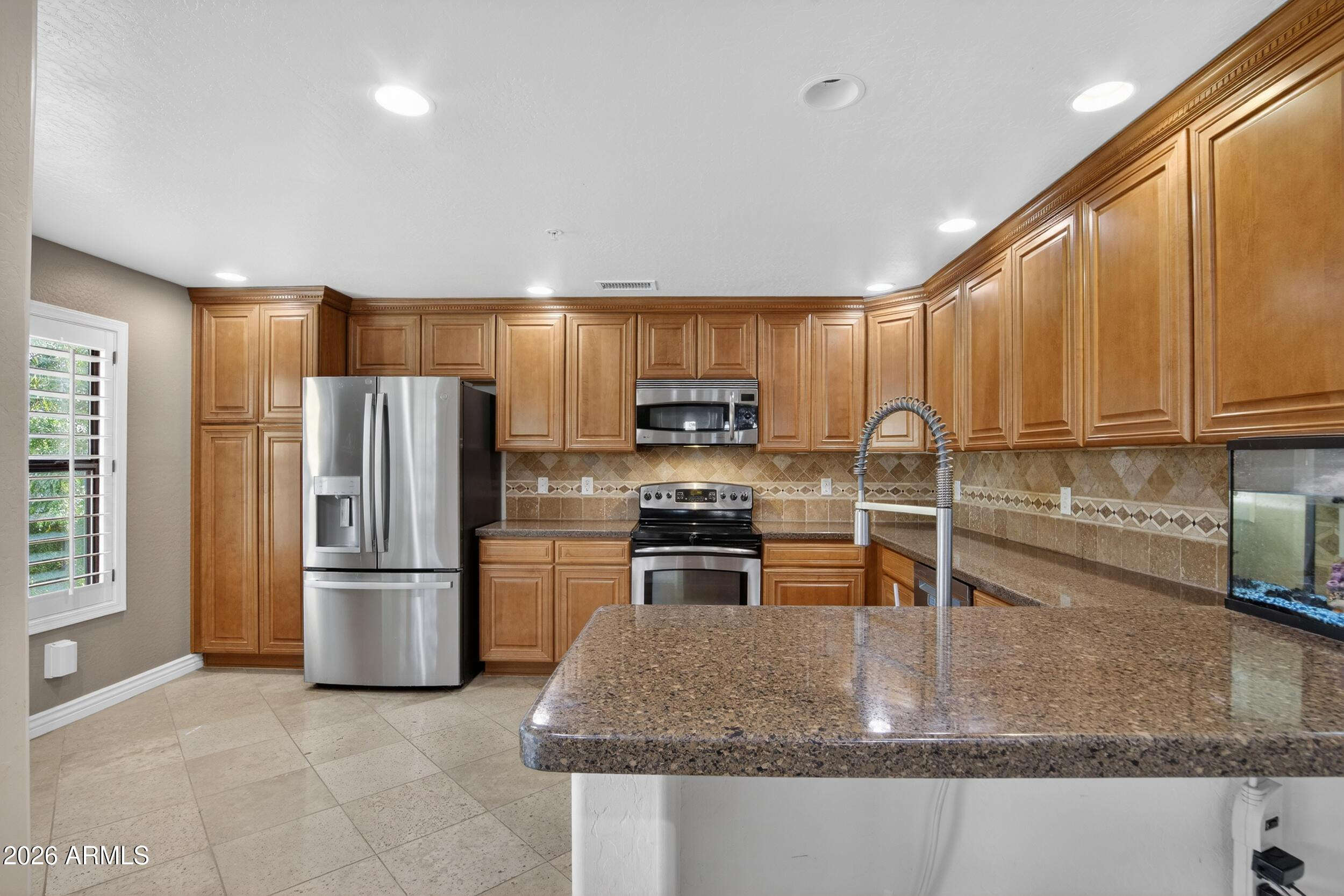 21320 North 56th Street, Unit 2125 Phoenix, AZ 85054 - Photo 21 of 39 a kitchen with stainless steel appliances granite countertop a refrigerator a stove top oven a sink and dishwasher