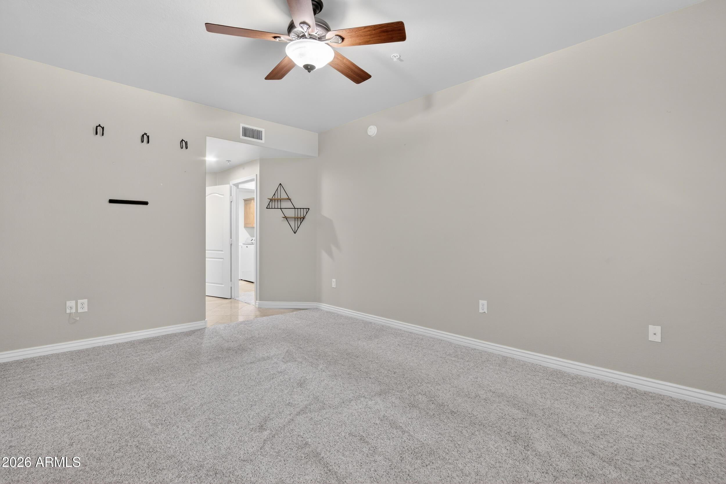 21320 North 56th Street, Unit 2125 Phoenix, AZ 85054 - Photo 23 of 39 a view of an empty room
