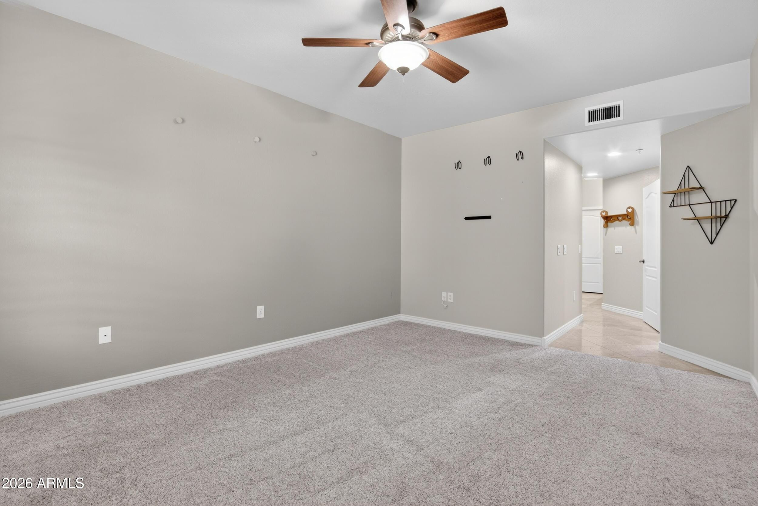 21320 North 56th Street, Unit 2125 Phoenix, AZ 85054 - Photo 25 of 39 a view of an empty room