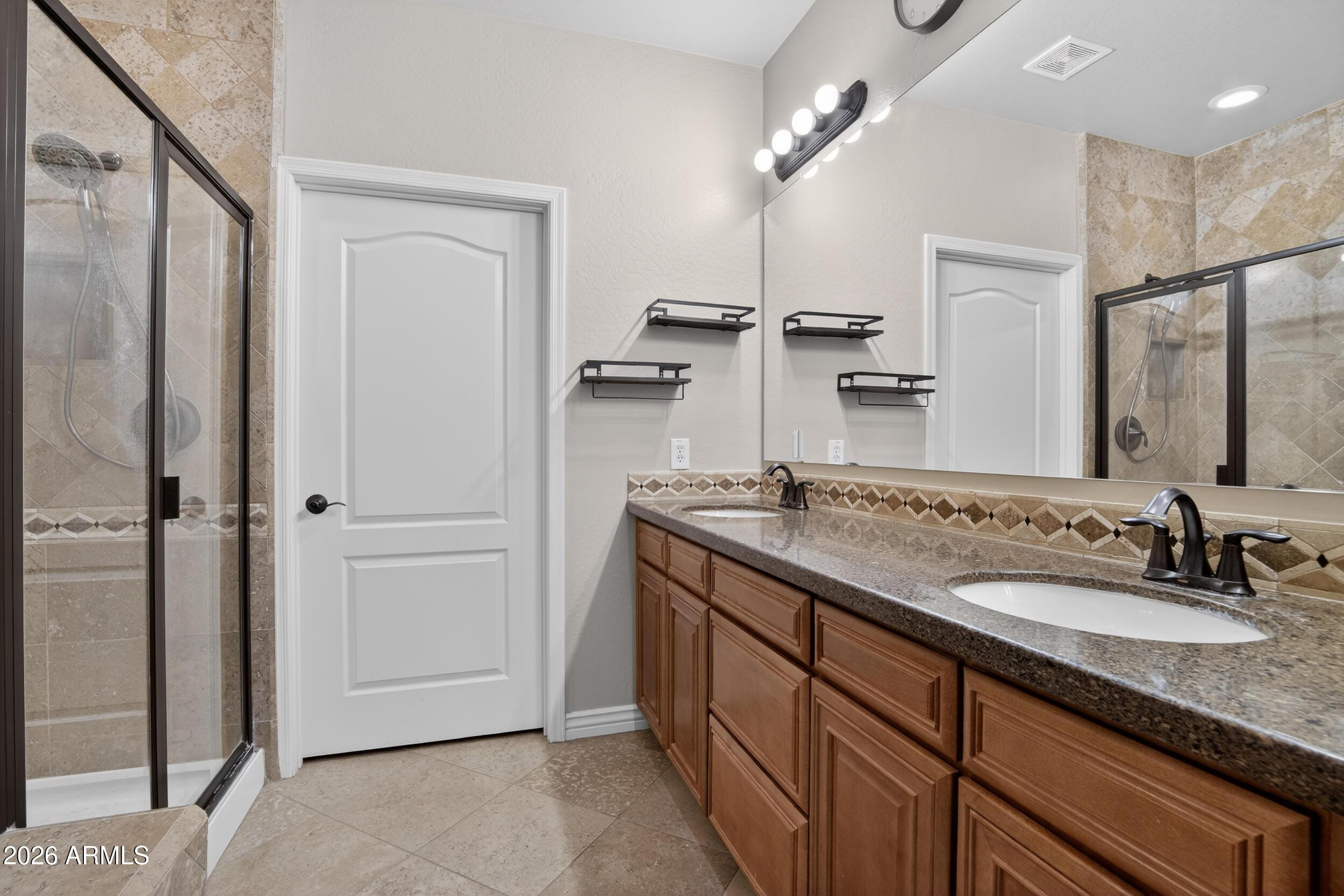 21320 North 56th Street, Unit 2125 Phoenix, AZ 85054 - Photo 26 of 39 a bathroom with a sink double vanity and a mirror