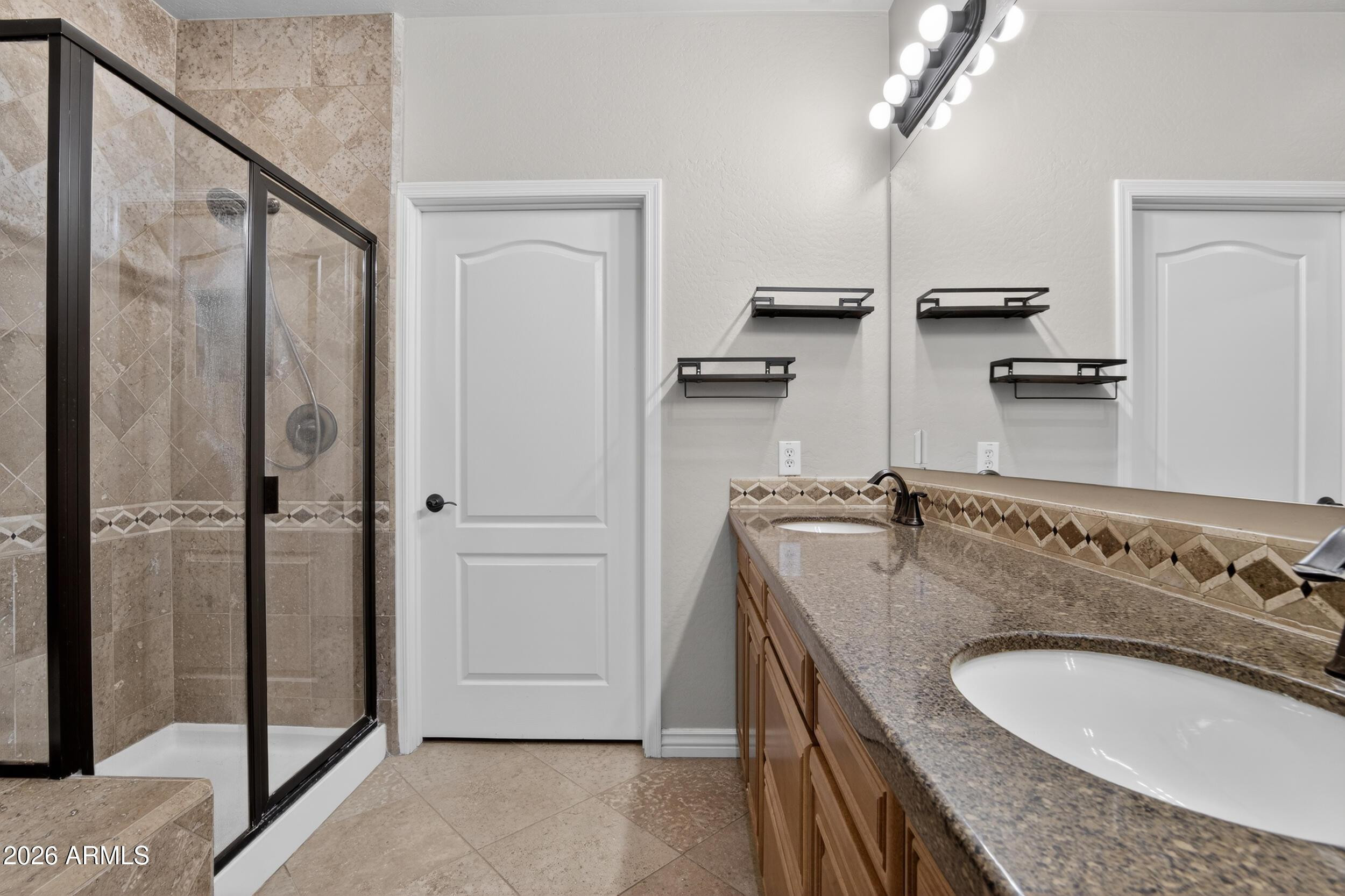 21320 North 56th Street, Unit 2125 Phoenix, AZ 85054 - Photo 27 of 39 a bathroom with a granite countertop sink a mirror and shower