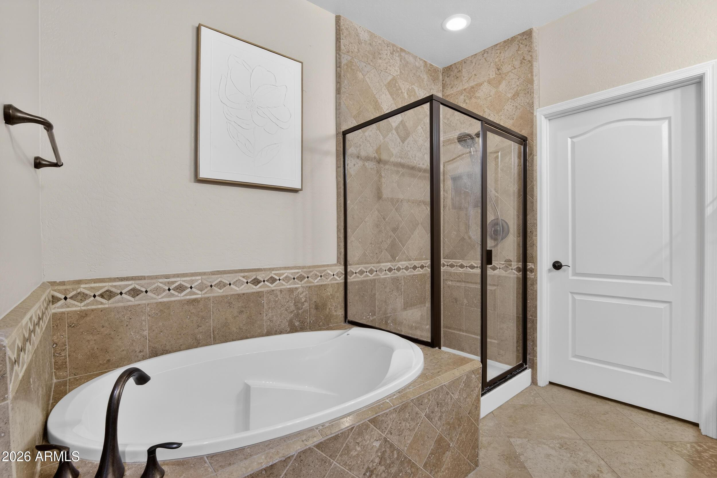 21320 North 56th Street, Unit 2125 Phoenix, AZ 85054 - Photo 29 of 39 a bathroom with a tub and shower