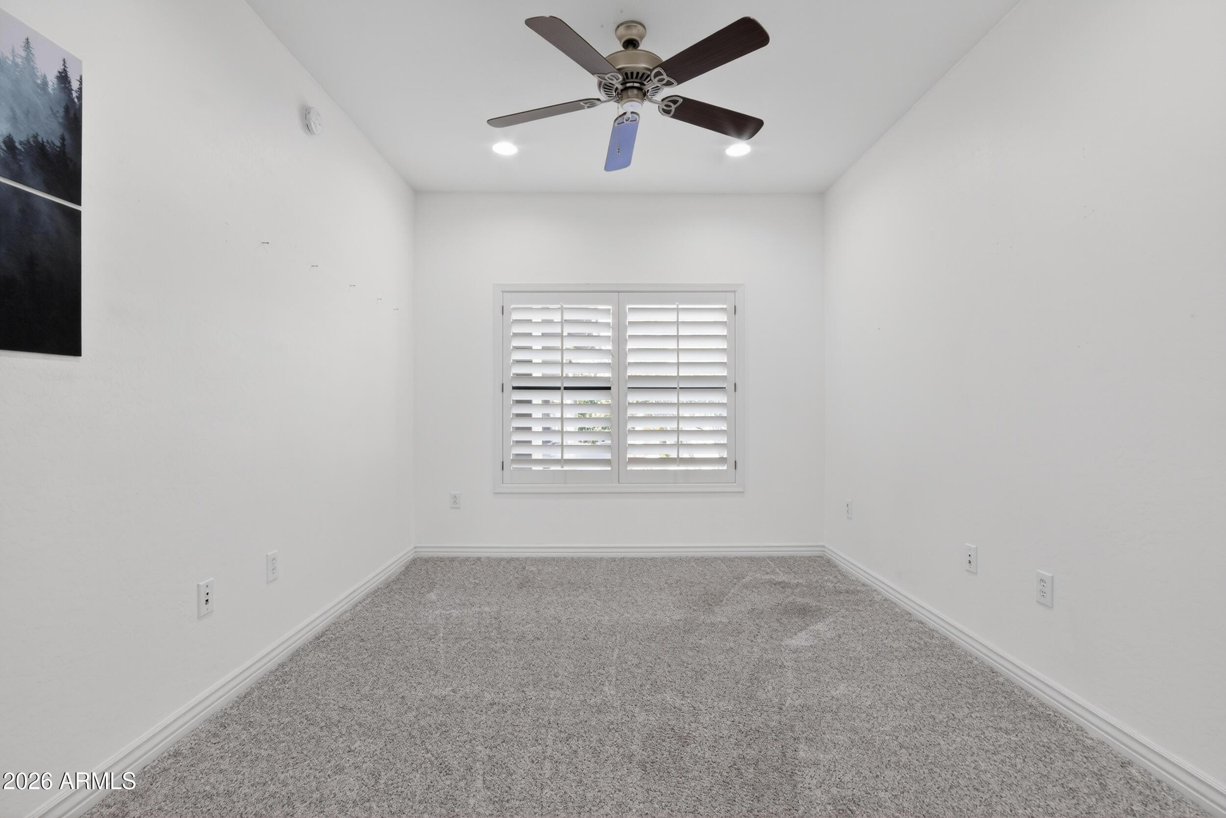 21320 North 56th Street, Unit 2125 Phoenix, AZ 85054 - Photo 33 of 39 an empty room with a window and a fan