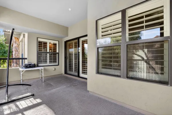 a view of a balcony with chairs