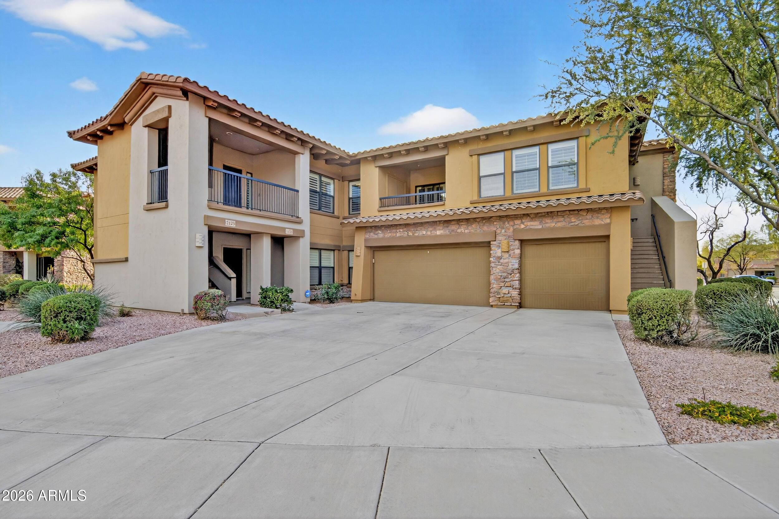 21320 North 56th Street, Unit 2125 Phoenix, AZ 85054 - Photo 4 of 39 front view of house with a yard