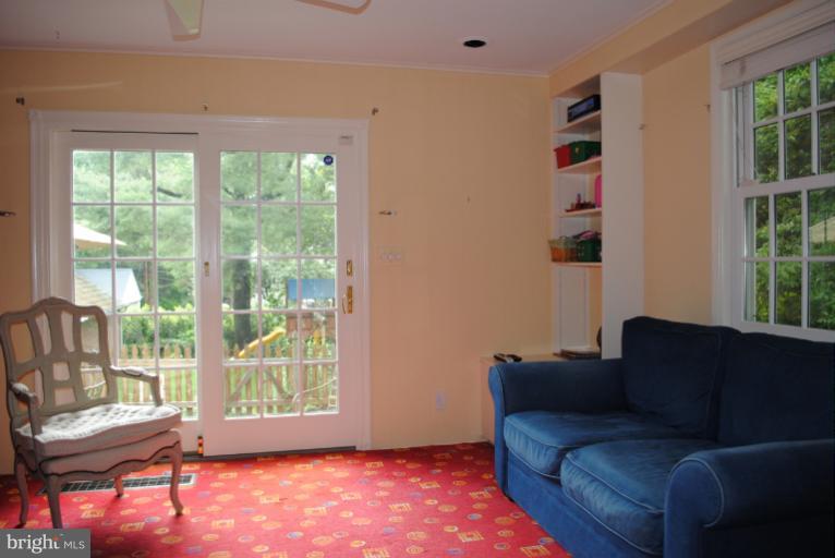 5803 Kenmore Road Baltimore, MD 21210 - Photo 1 of 29 a living room with furniture and a window