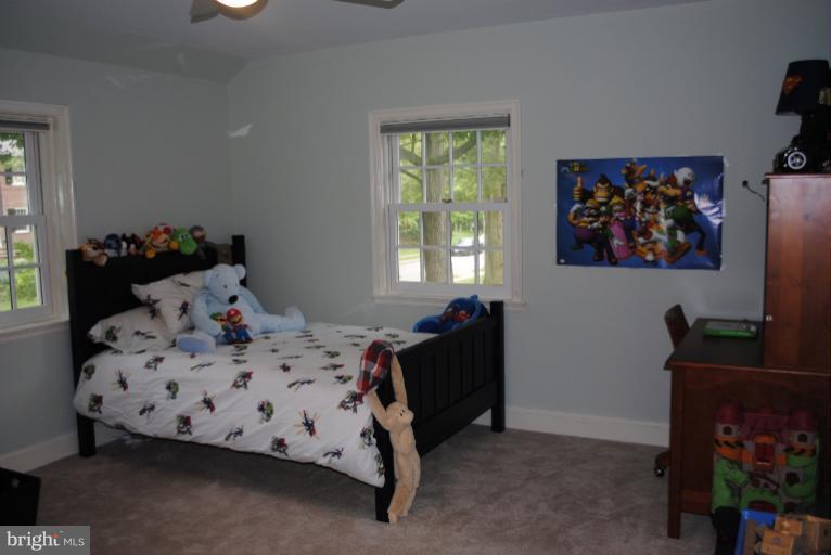 5803 Kenmore Road Baltimore, MD 21210 - Photo 2 of 29 a bedroom with a bed and window
