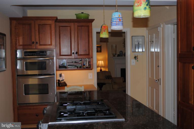 5803 Kenmore Road Baltimore, MD 21210 - Photo 13 of 29 a kitchen with stainless steel appliances granite countertop a refrigerator and a stove