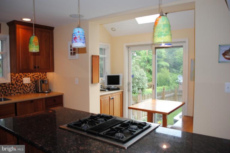 5803 Kenmore Road Baltimore, MD 21210 - Photo 16 of 29 a kitchen with a stove and a window