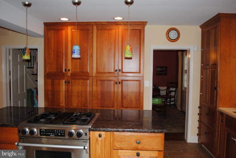 5803 Kenmore Road Baltimore, MD 21210 - Photo 17 of 29 a kitchen with a stove and a refrigerator