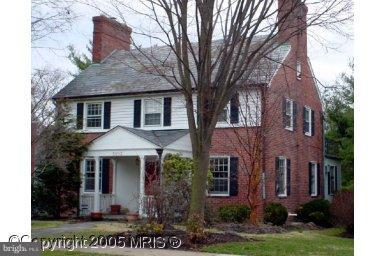 5803 Kenmore Road Baltimore, MD 21210 - Photo 20 of 29 a front view of a house with a yard