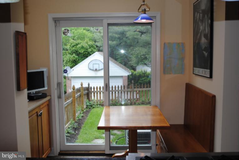 5803 Kenmore Road Baltimore, MD 21210 - Photo 5 of 29 a view of a balcony with a table and chairs