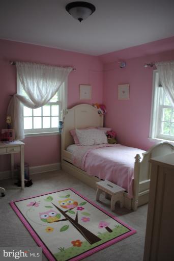 5803 Kenmore Road Baltimore, MD 21210 - Photo 8 of 29 a bedroom with a bed and a window