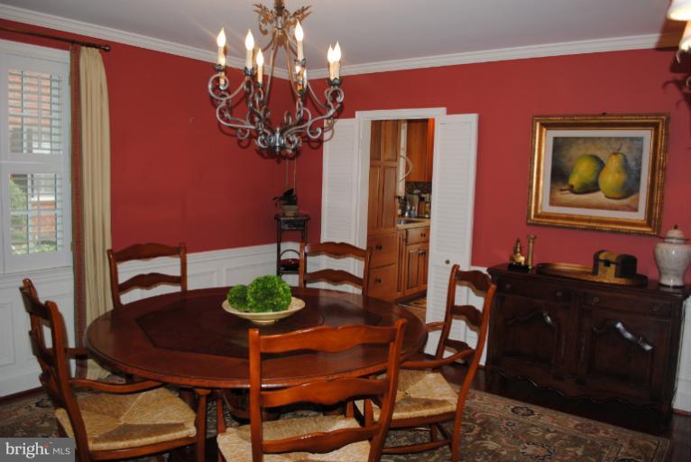 5803 Kenmore Road Baltimore, MD 21210 - Photo 9 of 29 a dining room with furniture and chandelier