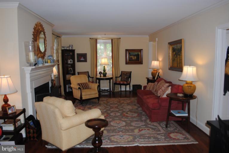 5803 Kenmore Road Baltimore, MD 21210 - Photo 10 of 29 a living room with furniture and a fireplace